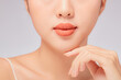 © Tuan  Nguyen  - A close view of model showing lip posing with hand for cosmetic advertising