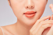 © Tuan  Nguyen  - A close view of model showing lip posing with hand for cosmetic advertising