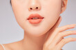 © Tuan  Nguyen  - A close view of model showing lip posing with hand for cosmetic advertising