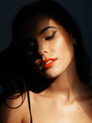 Canvas Print - Quiet sensuality. Studio shot of an attractive young woman posing against a dark background.