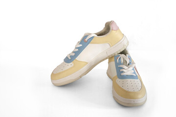 Footwear. Sneakers. Isolated crosses on a white background with clipping inclusive. Yellow and blue.