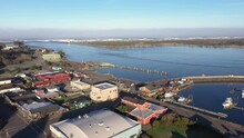 Old Town Bandon Oregon, USA. Drone Flyover. Coquille River Lighthouse In Distance.
