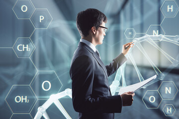 Poster - Medicine, bioengineering and technology concept with serious man in black suit using stylus working with digital touch screen with DNA and chemical compounds signs