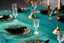 Table Setting Decorated Tableware With Gold Rim Candlesticks