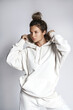 © blackday - Young woman stylish woman wearing white hoodie