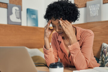 Aufkleber - Im dealing with crisis after crisis. Shot of a woman looking stressed while working from a cafe.