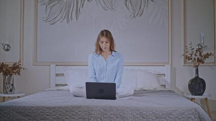 Aufkleber - blonde female wearing pajamas works in bedroom