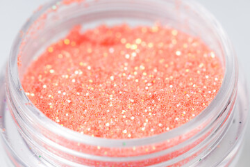Poster - colored sequins in a plastic jar close-up