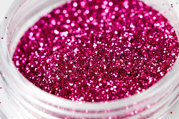 Poster - colored sequins in a plastic jar close-up