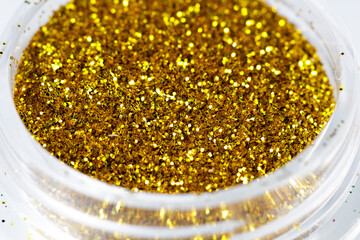 Poster - colored sequins in a plastic jar close-up