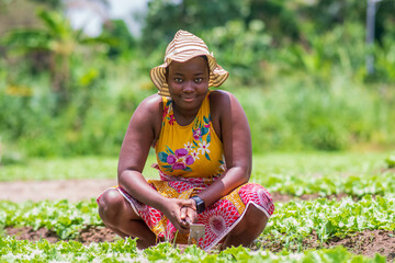 Female African woman at farm - concept on black people and agriculture