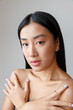 © Friends Stock - Young woman with perfect skin posing in studio