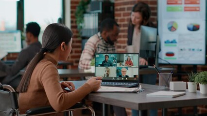 Poster - Multiethnic group of people meeting on remote teleconference to talk about business. Asian woman with disability attending online videoconference call on laptop computer, telecommunication.