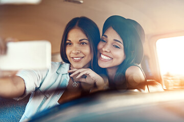 Sticker - Dont forget to collect the memories. Shot of two happy friends taking selfies with a mobile phone on a roadtrip.