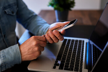 Wall Mural - man uses smartphone for mobile banking