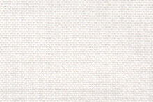 White Wool Braided Area Rug Texture Background, Bathroom Carpet. Close-up, Top View.