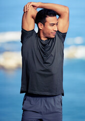 Poster - Stretching well encourages your blood to flow more. Shot of a sporty young man stretching his arms while exercising outdoors.