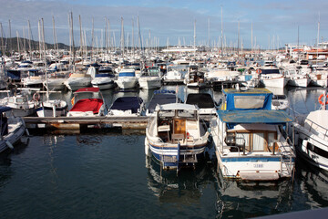 Wall Mural - boats moored at the Ibiza tourist pier in the summer