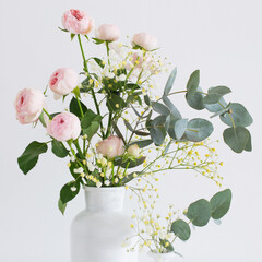 Poster - bouquet of pink roses in  two white vases  on white background