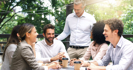 Poster - Merging their ideas around the table. Shot of a group of colleagues having a meeting at a cafe.