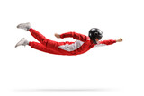 Fototapeta  - Car racer in a red suit and black helmet flying