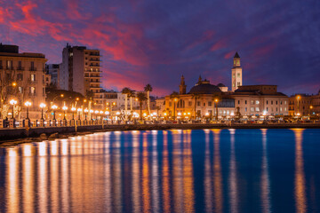 Wall Mural - Panoramic view of Bari, Southern Italy, the region of Puglia(Apulia) seafront at dusk. Basilica San Nicola in the background. 