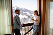 © BGStock72 - Young couple with cups of hot tea at winter window