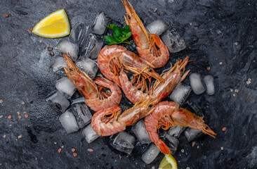 Wall Mural - Close up Shrimps, prawns. Seafood Red Argentine shrimps with ice, Wild shrimps, ocean jumbo shrimps. Food recipe background. top view