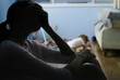 © kieferpix - tired stressed mother at home watching baby