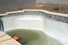 Residential Pool Being Drained And Cleaned 