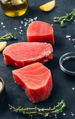 Wall Mural - Raw tuna fillet steak with thyme, lemon and ginger.