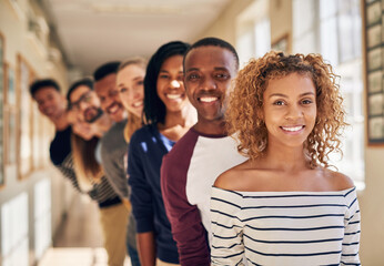 Fototapete - Greatness only begins here. Portrait of a diverse group of students standing in a line at campus.