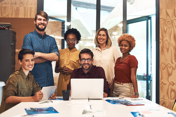Poster - Were a team of like-minded creatives. Portrait of a diverse group of businesspeople working together in an office.