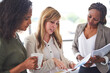 © Camerene P/peopleimages.com - Just another day in the office. Cropped shot of a group of businesswomen working in the office.