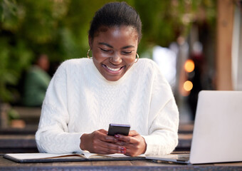 Poster - All the apps a student could want. Shot of a young woman using a smartphone while studying in a cafe.