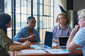 Poster - The best businesses have the best talent. Shot of a diverse group of businesspeople having a meeting in a modern office.
