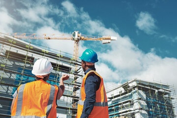 Poster - Their reputation is about to raise the roof. Shot of a young man and woman assessing progress of the building at a construction site.