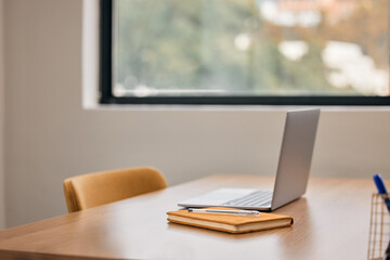 Sometimes freelancing is the way to go. Still life shot of a notebook and laptop on a desk in an office.