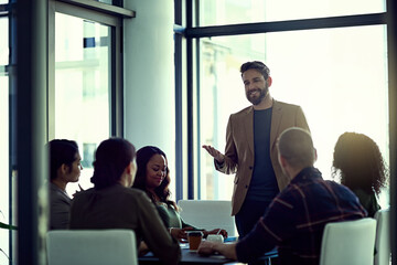 Poster - We succeed because we have the best team onboard. Shot of a businessman giving a presentation in the boardroom.