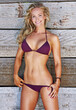 © Arcurs Co-op/peopleimages.com - Are you ready for summer. Shot of a beautiful woman posing in her bikini against a wooden background.