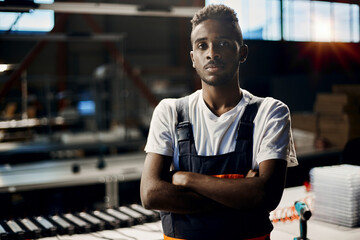 Wall Mural - portrait of african engineer working at factory