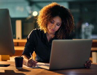 Poster - Being the best requires hard work and dedication. Shot of a young businesswoman using a laptop and writing notes during a late night at work.