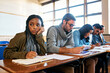 © K Seisa/peopleimages.com - Feeling a little bored. Cropped shot of an attractive young university student looking bored while sitting in class.