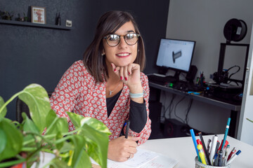 young brunette working at home