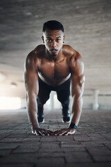 Sticker - This is what power looks like. Full length portrait of a handsome young man doing pushups while exercising outside.