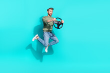 Full Body Photo Of Millennial Blond Guy Jump Drive Wear Sweater Jeans Footwear Isolated On Teal Background