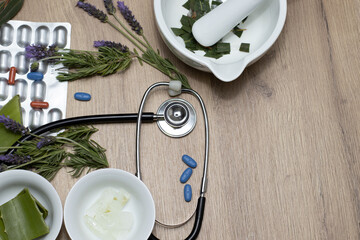 two blank bowls and a mortar with aloe vera on a background of plants and lavender and eucalyptus tablets with a stethoscope.