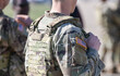 © Dragoș Asaftei - Detail view of the US Army uniform worn by soldiers in a military base. Flag of America on the uniform.