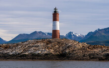 View Of Sea Lions And Cormorants On Les Eclaireurs Island With Lighthouse, Ushuaia, Tierra Del Fuego, Patagonia, Argentina.