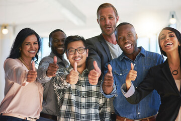 Aufkleber - Feeling positive about their career choice. Portrait of a group of happy creative colleagues showing a thumbs up together in the office.